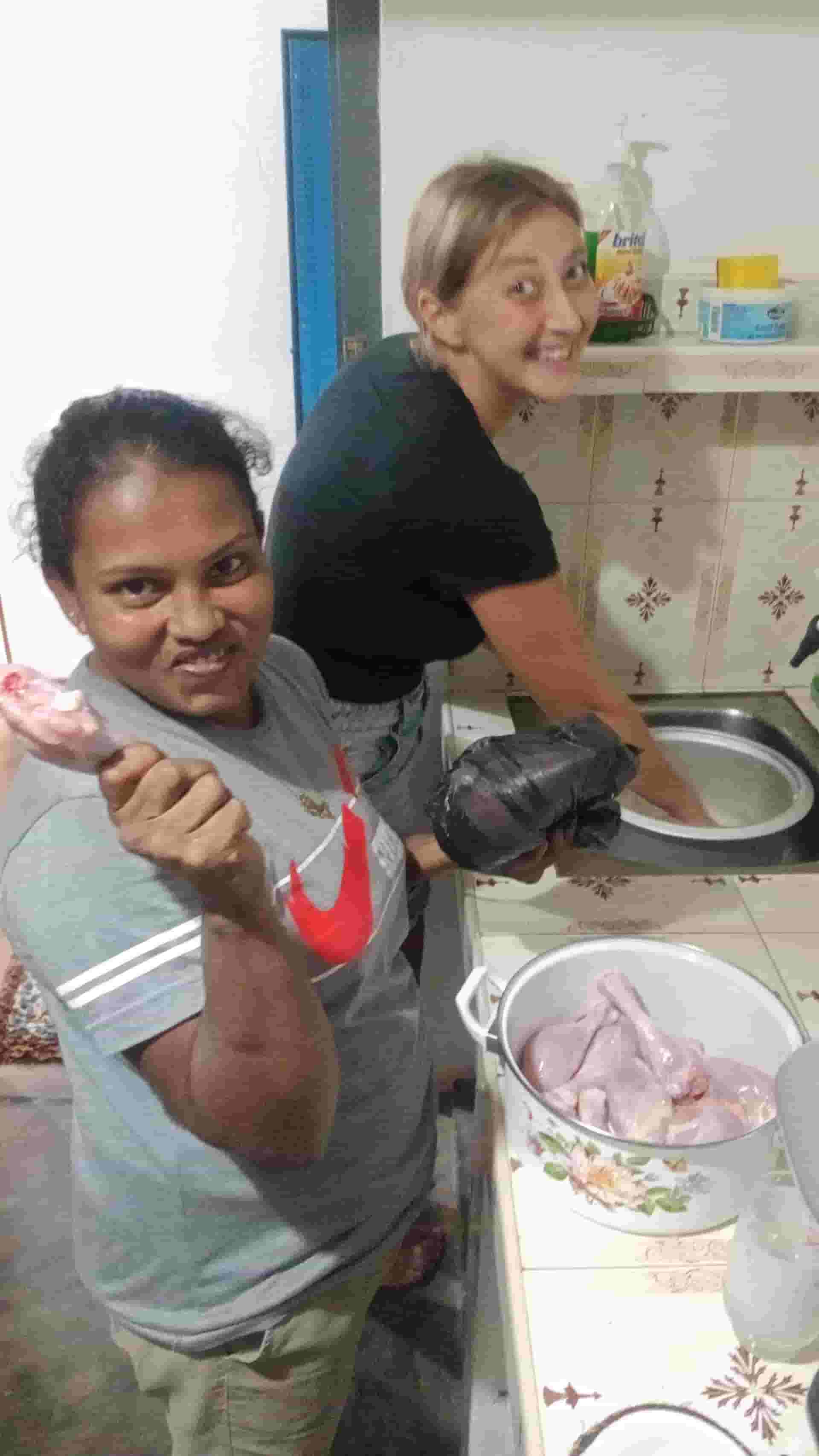 Nilani and guest preparing the family dinner