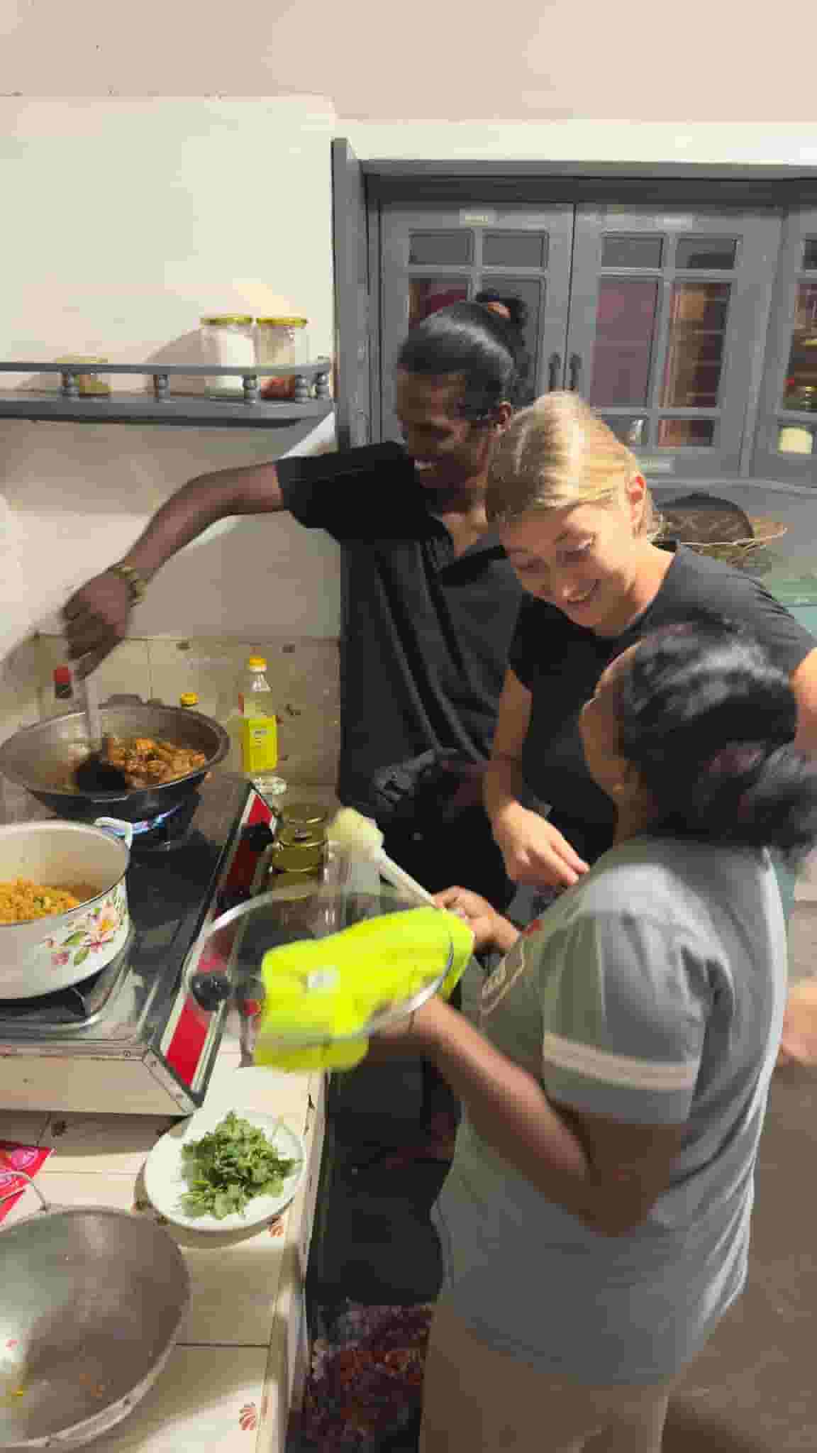 Residents and staff preparing the dinner together